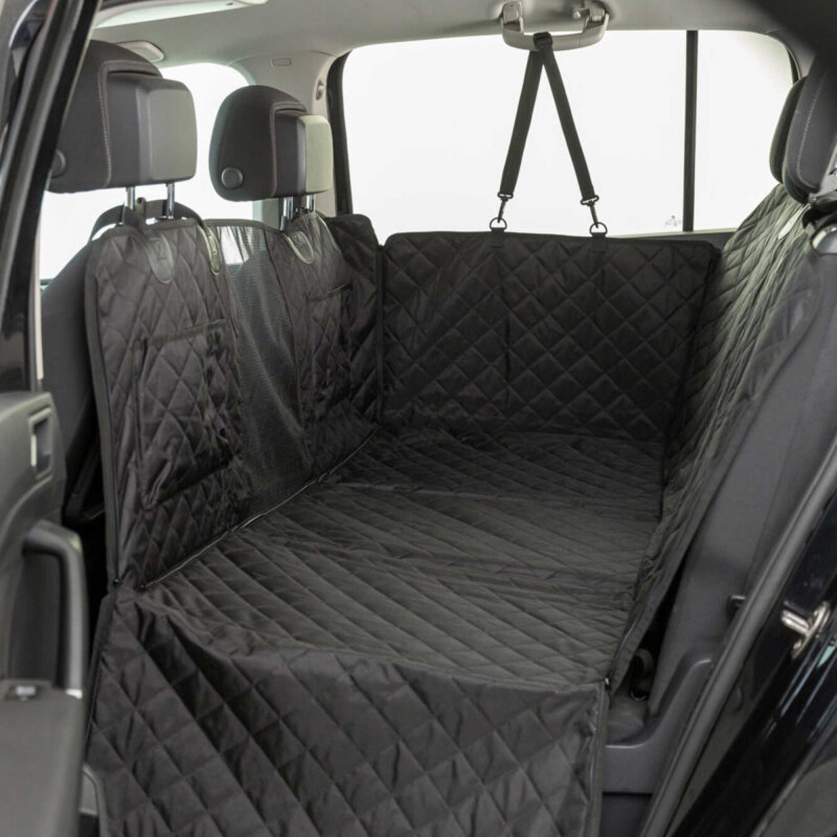 Car interior with a black quilted bench cover