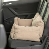 Beige pet bed in a car seat